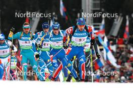 11.03.2011, Khanty-Mansiysk, Russia (RUS): Anton Shipulin (RUS), Madshus, Rottefella, adidas leads Fredrik Lindstroem (SWE), Fischer, Rottefella, Swix, adidas - IBU world championships biathlon, relay men, Khanty-Mansiysk (RUS). www.nordicfocus.com. © Manzoni/NordicFocus. Every downloaded picture is fee-liable.