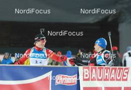 11.03.2011, Khanty-Mansiysk, Russia (RUS): Tarjei Boe (NOR), Fischer, Rottefella, Swix, ODLO, Michael Greis (GER), Madshus, Rottefella, OneWay, adidas - IBU world championships biathlon, relay men, Khanty-Mansiysk (RUS). www.nordicfocus.com. © Manzoni/NordicFocus. Every downloaded picture is fee-liable.