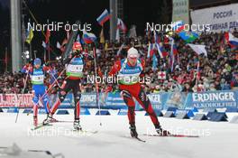 11.03.2011, Khanty-Mansiysk, Russia (RUS): Emil Hegle Svendsen (NOR), Madshus, Rottefella, Swix, Odlo leads Arnd Peiffer (GER), Fischer, Salomon, Swix, adidas, and Maxim Maksimov (RUS), Madshus, Rottefella, Swix, adidas - IBU world championships biathlon, relay men, Khanty-Mansiysk (RUS). www.nordicfocus.com. © Manzoni/NordicFocus. Every downloaded picture is fee-liable.