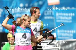 07.08.2011, Puettlingen, Germany (GER):  Irene Cadurisch (SUI), Fischer, Rottefella, Leki, ODLO, Serafin Wiestner (SUI)  - 7th ODLO City Biathlon, Puettlingen (GER). www.nordicfocus.com. © Manzoni/NordicFocus. Every downloaded picture is fee-liable.