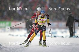 04.12.2011, Oestersund, Sweden (SWE): Magdalena Neuner (GER), Fischer, Rottefella, Swix, adidas, Toko leads Tora Berger (NOR), Fischer, Rottefella, Odlo - IBU world cup biathlon, pursuit women, Oestersund (SWE). www.nordicfocus.com. © Manzoni/NordicFocus. Every downloaded picture is fee-liable.