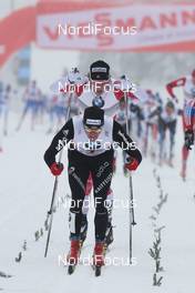 01.01.2011, Oberhof, Germany (GER): final sprint in front Dario Cologna (SUI), Fischer, Rottefella, Alpina, Swix, Odlo, behind Devon Kershaw (CAN), Fischer, Salomon, Swix  - FIS world cup cross-country, tour de ski, 15km men handicap start, Oberhof (GER). www.nordicfocus.com. © Hemmersbach/NordicFocus. Every downloaded picture is fee-liable.