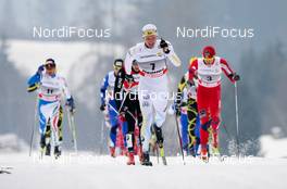 08.01.2011, Val di Fiemme, Italy (ITA): Daniel Rickrdsson (SWE), Fischer, Swix, Rottefella, Craft leading ahed of Dario Cologna (SUI), Fischer, Swix, Alpina, Rottefella, ODLO, Toko and Petter Northug (NOR), Fischer, Swix, Rottefella, Alpina, Skigo  - FIS world cup cross-country, tour de ski, mass men, Val di Fiemme (ITA). www.nordicfocus.com. © Laiho/NordicFocus. Every downloaded picture is fee-liable.