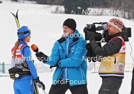 07.01.2011, Val di Fiemme, Italy (ITA): Arianna Follis (ITA), Fischer, Salomon, Swix in the interview with the German TV (ZDF) - FIS world cup cross-country, tour de ski, training, Val di Fiemme (ITA). www.nordicfocus.com. © Hemmersbach/NordicFocus. Every downloaded picture is fee-liable.
