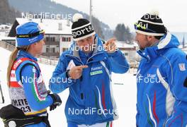 07.01.2011, Val di Fiemme, Italy (ITA): group, l-r: Arianna Follis (ITA), Fischer, Salomon, Swix, Freddy Stauder (ITA), coach woman Team Italy, Gianfranco Pizio (ITA) coach men Team Italy - FIS world cup cross-country, tour de ski, training, Val di Fiemme (ITA). www.nordicfocus.com. © Hemmersbach/NordicFocus. Every downloaded picture is fee-liable.
