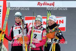 05.02.2011, Rybinsk, Russia (RUS): podium, l-r: Katja Visnar (SLO), Fischer, Rottefella, Vesna Fabjan (SLO), Fischer, Rottefella, Alpina, Swix , Justyna Kowalczyk (POL), Fischer, Salomon, Swix  - FIS world cup cross-country, individual sprint, Rybinsk (RUS). www.nordicfocus.com. © Hemmersbach/NordicFocus. Every downloaded picture is fee-liable.