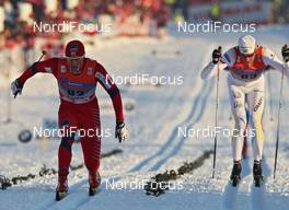 19.02.2011, Drammen, Norway (NOR): l-r: Petter Northug (NOR), Fischer, Rottefella, Alpina, Ski Go, Swix and Daniel Rickardsson (SWE), Fischer, Salomon, Swix  - FIS world cup cross-country, 15km men, Drammen (NOR). www.nordicfocus.com. © Hemmersbach/NordicFocus. Every downloaded picture is fee-liable.