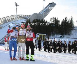 06.03.2011, Oslo, Norway (NOR): l-r: Maxim Vylegzhanin (RUS), Fischer, Rottefella, Alpina, Swix, adidas, Petter Northug (NOR), Fischer, Rottefella, Alpina, Ski Go, Swix , Tord Asle Gjerdalen (NOR), Atomic, Salomon, One Way, Swix during the medal ceremony - FIS nordic world ski championships, cross-country, mass  men, Oslo (NOR). www.nordicfocus.com. © Hemmersbach/NordicFocus. Every downloaded picture is fee-liable.
