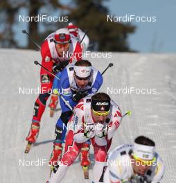 06.03.2011, Oslo, Norway (NOR): group, in the focus Ivan Babikov (CAN), Salomon, One Way and behind Lukas Bauer (CZE), Fischer, Rottefella, Alpina, Swix, Toko  - FIS nordic world ski championships, cross-country, mass  men, Oslo (NOR). www.nordicfocus.com. © Hemmersbach/NordicFocus. Every downloaded picture is fee-liable.