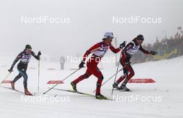 26.02.2011, Oslo, Norway (NOR): l-r: Aino Kaisa Saarinen (FIN), Rossignol, Rottefella, Alpina, One Way, Craft, Marit Bjoergen (NOR), Fischer, Rottefella, Swix, Justyna Kowalczyk (POL), Fischer, Salomon, Swix  - FIS nordic world ski championships, cross-country, pursuit women, Oslo (NOR). www.nordicfocus.com. © Hemmersbach/NordicFocus. Every downloaded picture is fee-liable.