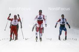 02.03.2011, Oslo, Norway (NOR): on the finishline l-r: Ola Vigen Hattestad (NOR), Fischer, Rottefella, Swix, Alex Harvey (CAN), Fischer, Salomon, Swix, Alexander Panzhinskiy (RUS), Adidas, Rossignol, Swix  - FIS nordic world ski championships, cross-country, team sprint, Oslo (NOR). www.nordicfocus.com. © Hemmersbach/NordicFocus. Every downloaded picture is fee-liable.