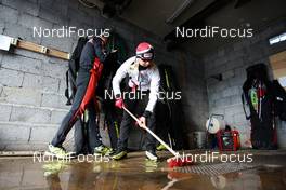 05.04.2011, Tana, Norway (NOR): Mari Laukkanen (FIN), Fischer, Exel, Rottefella drying the floor in the wax cabin  - Tour de Barents 2011, training, Tana (NOR). www.nordicfocus.com. © Laiho/NordicFocus. Every downloaded picture is fee-liable.