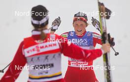 20.11.2011, Sjusjoen, Norway (NOR): (r-l) Astrid Jacobsen (NOR), Fischer, Swix, Rottefella and Marthe Kristoffersen (NOR), Atomic, Swix, Salomon celebrate the second place of team Norway II  - FIS world cup cross country, 4x5km women, Sjusjoen (NOR). www.nordicfocus.com. Â© Laiho/NordicFocus. Every downloaded picture is fee-liable.