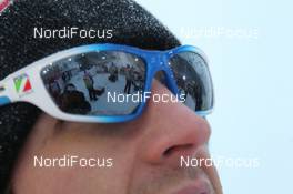 26.11.2011, Kuusamo, Finland (FIN): Comp Feature: Warm up area reflects in the glasses of the Atomic Service technician - FIS world cup cross-country, 5km women, Kuusamo (FIN). www.nordicfocus.com. © Manzoni/NordicFocus. Every downloaded picture is fee-liable.