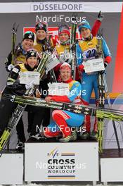 04.12.2011, Duesseldorf, Germany (GER): podium, 1st row l-r:  2nd Kikkan Randall (USA), Fischer, Salomon, Swix, 3rd Natalia Korosteleva (RUS), Fischer, Alpina, Rottefella, Swix, adidas, 2nd row l-r: 2nd Sadie Bjornsen (USA), Fischer, Salomon, Swix, 1st Mari Eide (NOR), Madshus, Rottefella, Alpina, Swix, 1st Maiken Caspersen Falla (NOR), Fischer, Rottefella, Alpina, Swix, 3rd Natalia Matveeva (RUS), Fischer, Alpina, Rottefella, adidas, Swix  - FIS world cup cross-country, team sprint, Duesseldorf (GER). www.nordicfocus.com. © Hemmersbach/NordicFocus. Every downloaded picture is fee-liable.