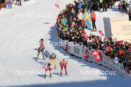 11.12.2011, Davos, Switzerland (SUI): Chandra Crawford (CAN), Fischer, Rottefella, Swix leads Marit Bjoergen (NOR), Fischer, Rottefella, Swix Denise Herrmann (GER), Atomic, adidas - FIS world cup cross-country, individual sprint, Davos (SUI). www.nordicfocus.com. © Manzoni/NordicFocus. Every downloaded picture is fee-liable.