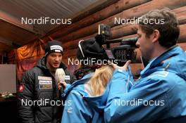 09.12.2011, Davos, Switzerland (SUI): Dario Cologna (SUI), Fischer, Rottefella, Alpina, Swix, ODLO, Casco during a FIS interview - FIS world cup cross-country, training, Davos (SUI). www.nordicfocus.com. © Manzoni/NordicFocus. Every downloaded picture is fee-liable.