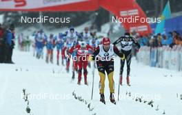 30.12.2011, Oberhof, Germany (GER): finish, in front Axel Teichmann (GER), Madshus, Rottefella, Swix, adidas, Toko, behind l-r: Petter Northug (NOR), Fischer, Rottefella, Alpina, Ski Go, Swix, Dario Cologna (SUI), Fischer, Rottefella, Alpina, Swix, Odlo  - FIS world cup cross-country, tour de ski, pursuit men, Oberhof (GER). www.nordicfocus.com. © Hemmersbach/NordicFocus. Every downloaded picture is fee-liable.
