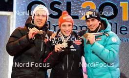 26.02.2011, Oslo, Norway (NOR): (l-r) Tino Edelmann (GER), Madshus, Leki, Rottefella, Adidas, Eric Frenzel (GER), Fischer, Leki, Salomon, Adidas and Felix Gottwald (AUT), Fischer, Swix, Loeffler  - FIS nordic world ski championships, nordic combined, individual gundersen HS106/10km, Oslo (NOR). www.nordicfocus.com. © Laiho/NordicFocus. Every downloaded picture is fee-liable.
