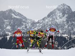 10.12.2011, Ramsau, Austria (AUT): group in front of the Dachstein mountains, in front Jason Lamy-Chappuis (FRA), Salomon, Swix, One Way, behind l-r: Jan Schmid (NOR), Fischer, Rottefella, Swix, Tino Edelmann (GER), Elan, Madshus, Rottefella, adidas, Wilhelm Denifl (AUT), Atomic, Salomon, Leki  - FIS world cup nordic combined, individual gundersen HS98/10km, Ramsau (AUT). www.nordicfocus.com. © Hemmersbach/NordicFocus. Every downloaded picture is fee-liable.