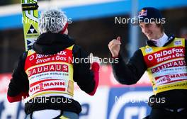 06.02.2011, Oberstdorf, Germany (GER): (r-l) Gregor Schlierenzauer (AUT), Fischer congratulates his team mate Thomas Morgenstern (AUT), Fischer  - FIS world cup ski jumping, team HS213, Oberstdorf (GER). www.nordicfocus.com. © Laiho/NordicFocus. Every downloaded picture is fee-liable.