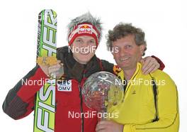20.03.2011, Planica, Slovenia (SLO): Overall World Cup Winner Thomas Morgenstern (AUT), Fischer with his father - FIS world cup ski jumping final, cups, Planica (SLO). www.nordicfocus.com. © Hemmersbach/NordicFocus. Every downloaded picture is fee-liable.
