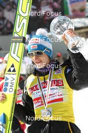 20.03.2011, Planica, Slovenia (SLO): Sky Flying World Cup Overall Winner Gregor Schlierenzauer (AUT), Fischer  - FIS world cup ski jumping final, cups, Planica (SLO). www.nordicfocus.com. © Hemmersbach/NordicFocus. Every downloaded picture is fee-liable.