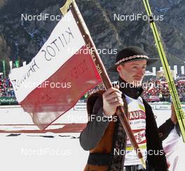 20.03.2011, Planica, Slovenia (SLO): Adam Malysz (POL), Fischer celebrates the end of his carreer in a traditional polish costume - FIS world cup ski jumping final, individual HS215, Planica (SLO). www.nordicfocus.com. © Hemmersbach/NordicFocus. Every downloaded picture is fee-liable.