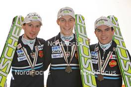 18.03.2011, Planica, Slovenia (SLO): Slovenian Ski Jumping Team, l-r: Robert Kranjec (SLO), Fischer, Jurij Tepes (SLO), Fischer, Jernej Damjan (SLO), Fischer  - FIS world cup ski jumping final, medals, Planica (SLO). www.nordicfocus.com. © Hemmersbach/NordicFocus. Every downloaded picture is fee-liable.