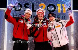 26.02.2011, Oslo, Norway (NOR):  (l-r) Andreas Kofler (AUT), Fischer, Thomas Morgenstern (AUT), Fischer and Adam Malysz (POL), Fischer- FIS nordic world ski championships, ski jumping, individual HS106, Oslo (NOR). www.nordicfocus.com. © Laiho/NordicFocus. Every downloaded picture is fee-liable.