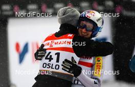 26.02.2011, Oslo, Norway (NOR): (l-r) Kamil Stoch (POL), Fischer congratules Adam Malysz (POL), Fischer  - FIS nordic world ski championships, ski jumping, individual HS106, Oslo (NOR). www.nordicfocus.com. © Laiho/NordicFocus. Every downloaded picture is fee-liable.