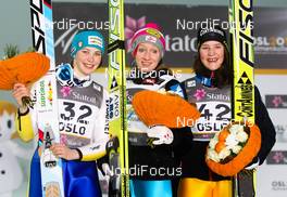 25.02.2011, Oslo, Norway (NOR):  the three best women, (l-r) Elena Runggaldier (ITA), Sporten, the winner Daniela Iraschko (AUT), Fischer and Coline Mattel (FRA), Fischer - FIS nordic world ski championships, ski jumping, individual HS106 women, Oslo (NOR). www.nordicfocus.com. © Laiho/NordicFocus. Every downloaded picture is fee-liable.