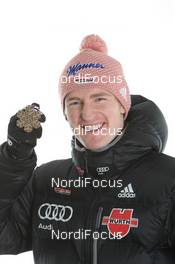 27.02.2011, Oslo, Norway (NOR): Bronce Medal Team; Severin Freund (GER), Fischer - FIS nordic world ski championships, ski jumping, medals, Oslo (NOR). www.nordicfocus.com. © Hemmersbach/NordicFocus. Every downloaded picture is fee-liable.