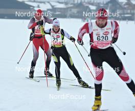 12.-13.02.2011, St. Johann, Austria (AUT): Sigrid Mutscheller (GER), Fischer Racing Team, runs in a small group of men - Int. Tiroler Koasalauf, St. Johann (AUT). www.nordicfocus.com. © Felgenhauer/NordicFocus. Every downloaded picture is fee-liable.