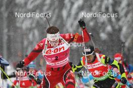 08.01.2012, Oberhof, Germany (GER): Emil Hegle Svendsen (NOR), Madshus, Rottefella, Swix, Odlo, Simon Fourcade (FRA), Fischer, Rottefella, Rossignol, Swix, Odlo - IBU world cup biathlon, mass men, Oberhof (GER). www.nordicfocus.com. © Manzoni/NordicFocus. Every downloaded picture is fee-liable.