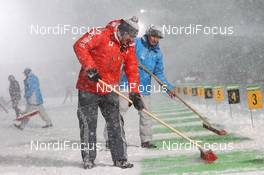 05.01.2012, Oberhof, Germany (GER): Franz Berger (AUT), IBU race director cleans the shooting range - IBU world cup biathlon, relay men, Oberhof (GER). www.nordicfocus.com. © Manzoni/NordicFocus. Every downloaded picture is fee-liable.