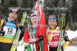 22.01.2012, Antholz, Italy (ITA): L-R: Anastasiya Kuzmina (SVK), Fischer, Salomon, Start, Darya Domracheva (BLR), Fischer, Rottefella, Leki, Magdalena Neuner (GER), Fischer, Rottefella, Swix, adidas, Toko - IBU world cup biathlon, mass women, Antholz (ITA). www.nordicfocus.com. © Manzoni/NordicFocus. Every downloaded picture is fee-liable.
