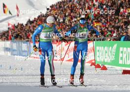 22.01.2012, Antholz, Italy (ITA): Rene Laurent Vuillermoz (ITA), Rossignol, Rottefella, Exel, Dominik Windisch (ITA), Fischer, Rottefella, Alpina, Leki - IBU world cup biathlon, relay men, Antholz (ITA). www.nordicfocus.com. © Manzoni/NordicFocus. Every downloaded picture is fee-liable.