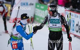04.02.2012, Holmenkollen, Norway (NOR):  (l-r) Christian de Lorenzi (ITA), Atomic, Rottefella, Alpina, OneWay and Benjamin Weger (SUI), Atomic, Leki, Casco, ODLO - IBU world cup biathlon, pursuit men, Holmenkollen (NOR). www.nordicfocus.com. Â© Laiho/NordicFocus. Every downloaded picture is fee-liable.