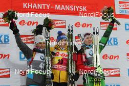 16.03.2012, Khanty-Mansiysk, Russia (RUS): L-R: Vita Semerenko (UKR), Fischer, Salomon, Swix, Magdalena Neuner (GER), Fischer, Rottefella, Swix, adidas, Toko, Darya Domracheva (BLR), Fischer, Rottefella, Leki - IBU world cup biathlon, sprint women, Khanty-Mansiysk (RUS). www.nordicfocus.com. © Manzoni/NordicFocus. Every downloaded picture is fee-liable.