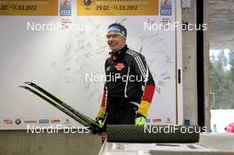 06.03.2012, Ruhpolding, Germany (GER): Andreas Birnbacher (GER), Fischer, Rottefella, Alpina, Leki, adidas walks to the ski marking - IBU world championships biathlon, individual men, Ruhpolding (GER). www.nordicfocus.com. © Manzoni/NordicFocus. Every downloaded picture is fee-liable.