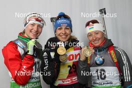 03.03.2012, Ruhpolding, Germany (GER): L-R: Darya Domracheva (BLR), Fischer, Rottefella, Leki, Magdalena Neuner (GER), Fischer, Rottefella, Swix, adidas, Toko, Vita Semerenko (UKR), Fischer, Salomon, Swix - IBU world championships biathlon, medals, Ruhpolding (GER). www.nordicfocus.com. © Manzoni/NordicFocus. Every downloaded picture is fee-liable.