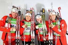 01.03.2012, Ruhpolding, Germany (GER): L-R: Emil Hegle Svendsen (NOR), Madshus, Rottefella, Swix, Odlo, Synnoeve Solemdal (NOR), Madshus, Rottefella, Swix, ODLO, Tim Burke (USA), Rossignol, Rottefella, OneWay, adidas, Ole Einar Bjoerndalen (NOR), Madshus, Rottefella, Odlo - IBU world championships biathlon, medals, Ruhpolding (GER). www.nordicfocus.com. © Manzoni/NordicFocus. Every downloaded picture is fee-liable.