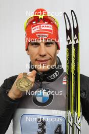 09.03.2012, Ruhpolding, Germany (GER): Arnd Peiffer (GER), Fischer, Salomon, OneWay, adidas - IBU world championships biathlon, medals, Ruhpolding (GER). www.nordicfocus.com. © Manzoni/NordicFocus. Every downloaded picture is fee-liable.
