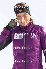 15.03.2012, Ruhpolding, Germany (GER): Elise Ringen (NOR), Fischer, Rottefella, Odlo - IBU world championships biathlon, medals, Ruhpolding (GER). www.nordicfocus.com. © Manzoni/NordicFocus. Every downloaded picture is fee-liable.