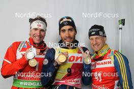 03.03.2012, Ruhpolding, Germany (GER): L-R: Emil Hegle Svendsen (NOR), Madshus, Rottefella, Swix, Odlo, Martin Fourcade (FRA), Rossignol, Rottefella, OneWay, Carl-Johan Bergman (SWE), Rossignol, Rottefella, Leki, adidas - IBU world championships biathlon, medals, Ruhpolding (GER). www.nordicfocus.com. © Manzoni/NordicFocus. Every downloaded picture is fee-liable.