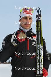 15.03.2012, Ruhpolding, Germany (GER): Arnd Peiffer (GER), Fischer, Salomon, OneWay, adidas - IBU world championships biathlon, medals, Ruhpolding (GER). www.nordicfocus.com. © Manzoni/NordicFocus. Every downloaded picture is fee-liable.