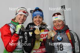 03.03.2012, Ruhpolding, Germany (GER): L-R: Darya Domracheva (BLR), Fischer, Rottefella, Leki, Magdalena Neuner (GER), Fischer, Rottefella, Swix, adidas, Toko, Vita Semerenko (UKR), Fischer, Salomon, Swix - IBU world championships biathlon, medals, Ruhpolding (GER). www.nordicfocus.com. © Manzoni/NordicFocus. Every downloaded picture is fee-liable.
