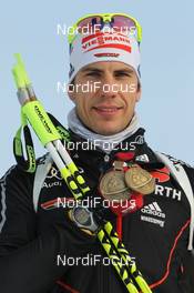 15.03.2012, Ruhpolding, Germany (GER): Arnd Peiffer (GER), Fischer, Salomon, OneWay, adidas - IBU world championships biathlon, medals, Ruhpolding (GER). www.nordicfocus.com. © Manzoni/NordicFocus. Every downloaded picture is fee-liable.