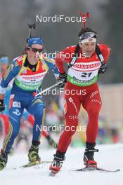 04.03.2012, Ruhpolding, Germany (GER): Ole Einar Bjoerndalen (NOR), Madshus, Rottefella, Odlo, Fredrik Lindstroem (SWE), Fischer, Rottefella, Swix, adidas - IBU world championships biathlon, pursuit men, Ruhpolding (GER). www.nordicfocus.com. © Manzoni/NordicFocus. Every downloaded picture is fee-liable.